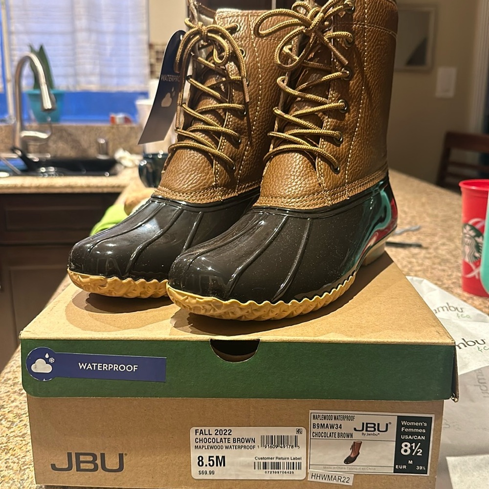 Size 8.5 women’s JBU rain boots. Never worn.
